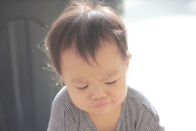 Portrait of cute girl looking down