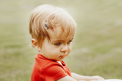 Close-up of cute baby looking away