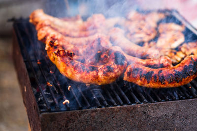 High angle view of meat on barbecue grill