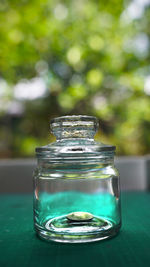 Close-up of glass jar on table