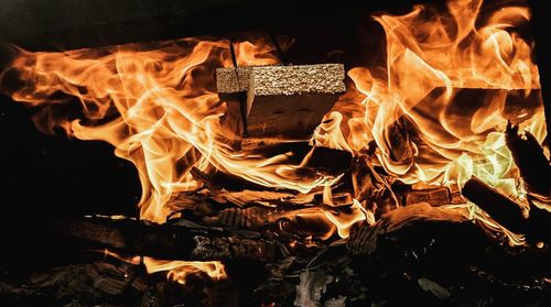 Close-up of fire burning at night