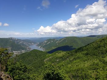 High angle view of green landscape against sky