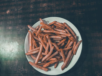 Directly above shot of french fries in plate on table