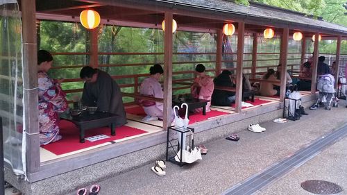 People sitting in illuminated building