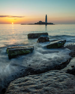 Scenic view of sea against sky during sunset