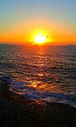 Scenic view of sea against romantic sky during sunset