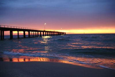 View of bridge over sea against sky during sunset