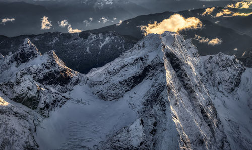 Scenic view of snowcapped mountains against sky