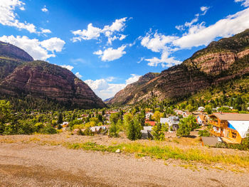 Panoramic shot of trees and buildings against sky