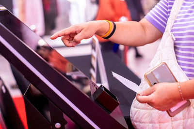 Midsection of business people shaking hands