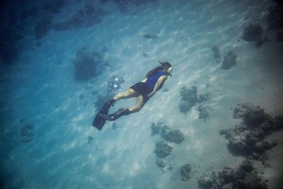 Low angle view of person swimming in sea