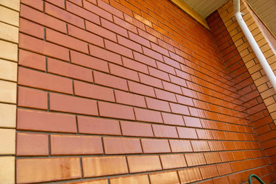 Low angle view of brick wall in building