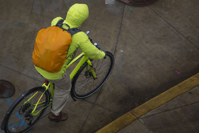 High angle view of man cycling on street