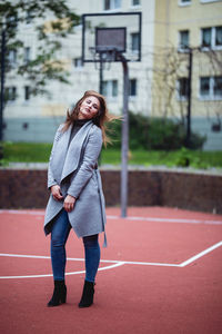 Full length of woman standing outdoors