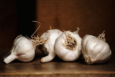 Close-up of garlics on table