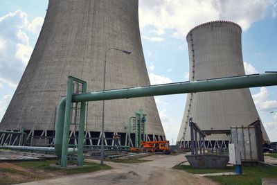 Low angle view of factory against sky