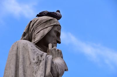 Low angle view of statue against sky