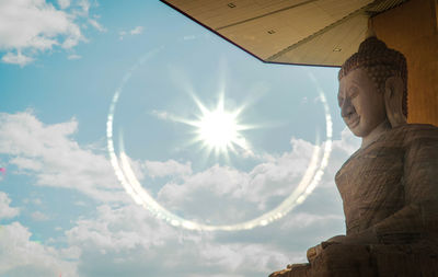 Low angle view of statue against sky