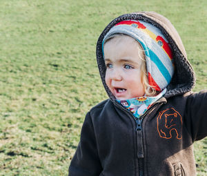 Portrait of cute boy on field