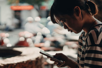 Close-up of woman using mobile phone