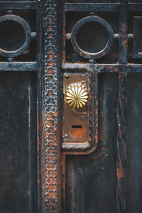 Close-up of rusty metal gate