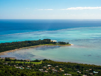 Paradise golf resort by tourquise ocean from high angle view in le morne beach, mauritius