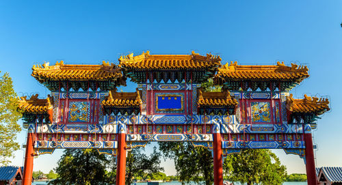 Low angle view of building against clear blue sky