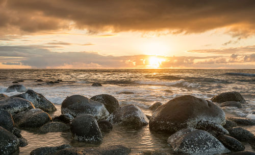 Scenic view of sea against sky during sunset