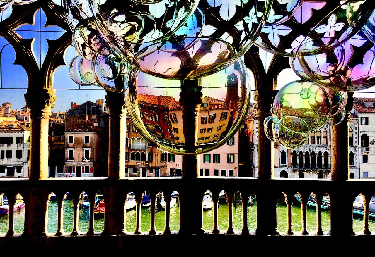 REFLECTION OF BUILDINGS ON GLASS