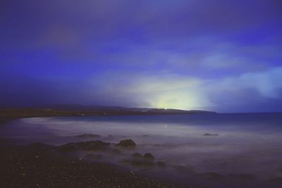 Scenic view of sea against sky at night