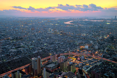 High angle view of city against sky during sunset