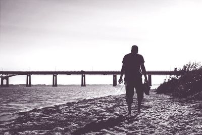 Man standing on pier