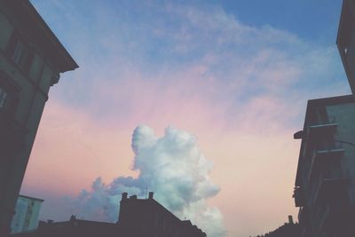 Low angle view of building against cloudy sky