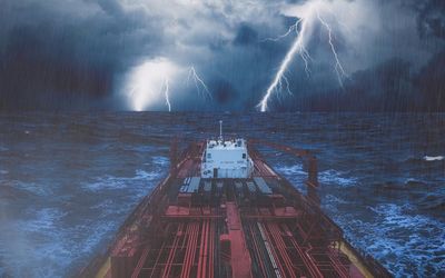 Panoramic view of lightning over sea against sky