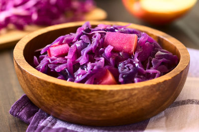 Close-up of purple flowers in bowl on table