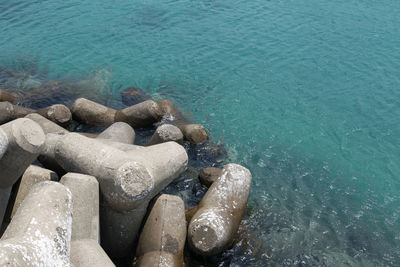 High angle view of tetrapods by sea