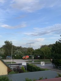 High angle view of road by buildings against sky