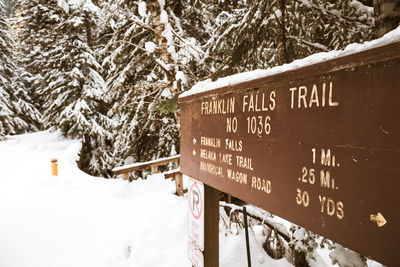 Information sign on snow covered land