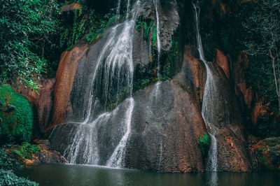 Water flowing through rocks in forest