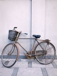 Bicycle leaning against wall