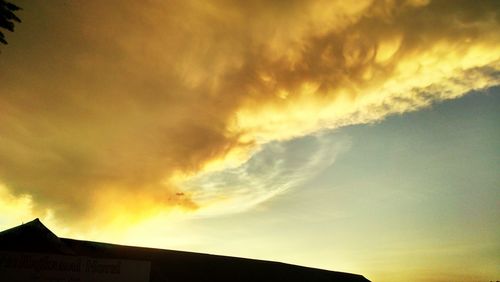 Low angle view of cloudy sky at sunset