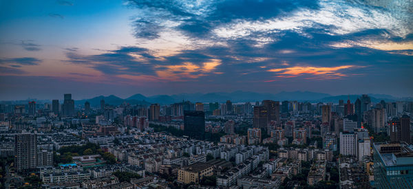 High angle view of cityscape against sky during sunset