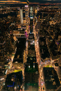 High angle view of illuminated buildings in city at night