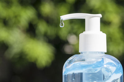 Close-up of water bottle against black background