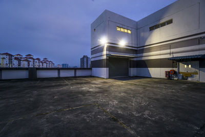 Illuminated building in city at night