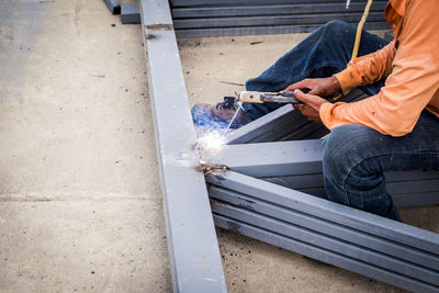 Low section of welder welding metal 