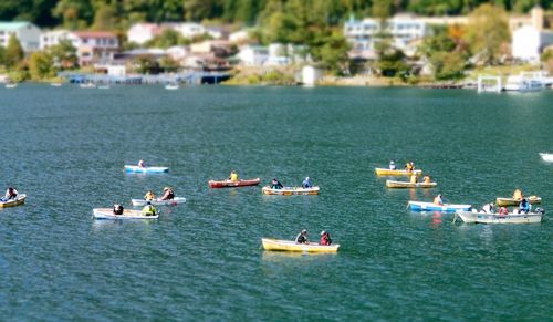 People on boats in water