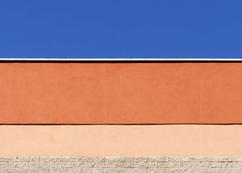 Low angle view of building against clear blue sky