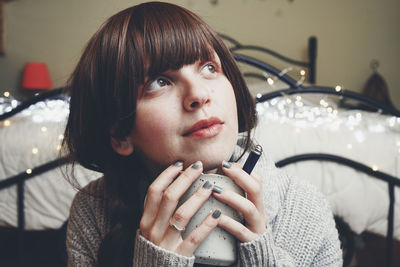 Portrait of young woman looking away