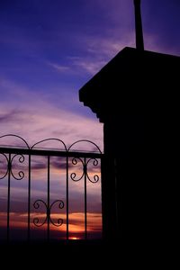 Silhouette of building at sunset